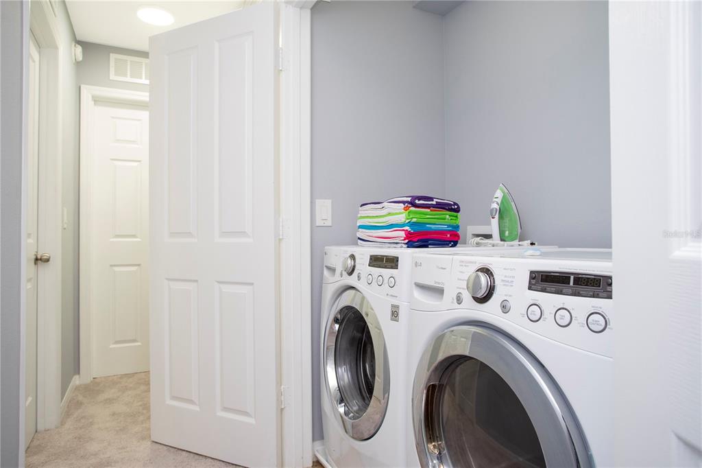 3181 Tocoa Circle Kissimmee, FL 34746 - Photo 54 of 87 a utility room with dryer and washer