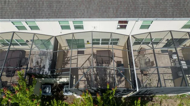 a view of a livingroom with wooden floor and furniture