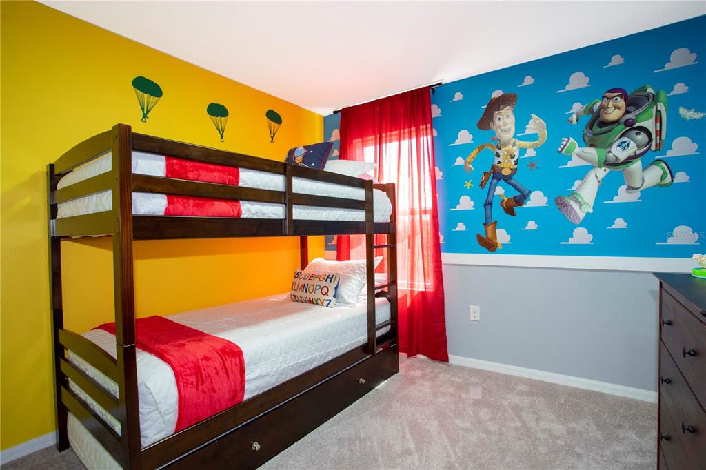 3181 Tocoa Circle Kissimmee, FL 34746 - Photo 71 of 87 a bedroom with a bed and a window