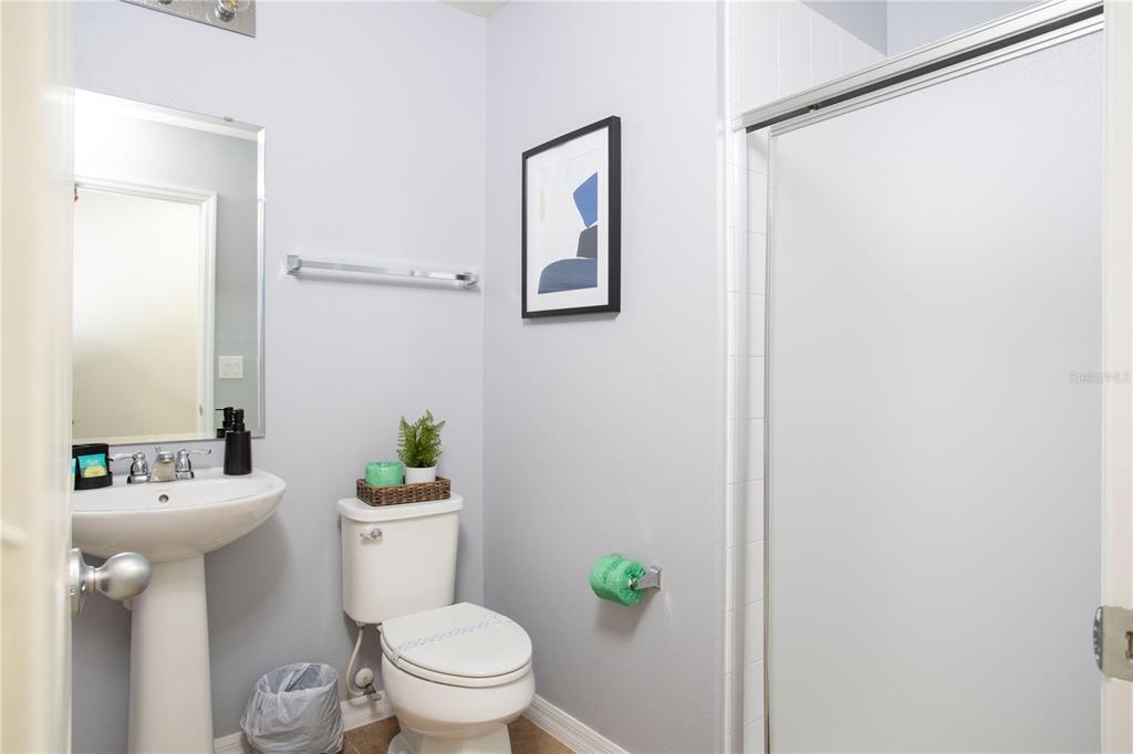 3181 Tocoa Circle Kissimmee, FL 34746 - Photo 78 of 87 a bathroom with a sink mirror and toilet