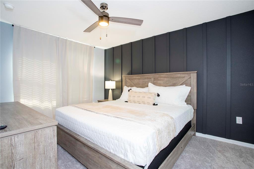 3181 Tocoa Circle Kissimmee, FL 34746 - Photo 81 of 87 a bedroom with a bed and a window