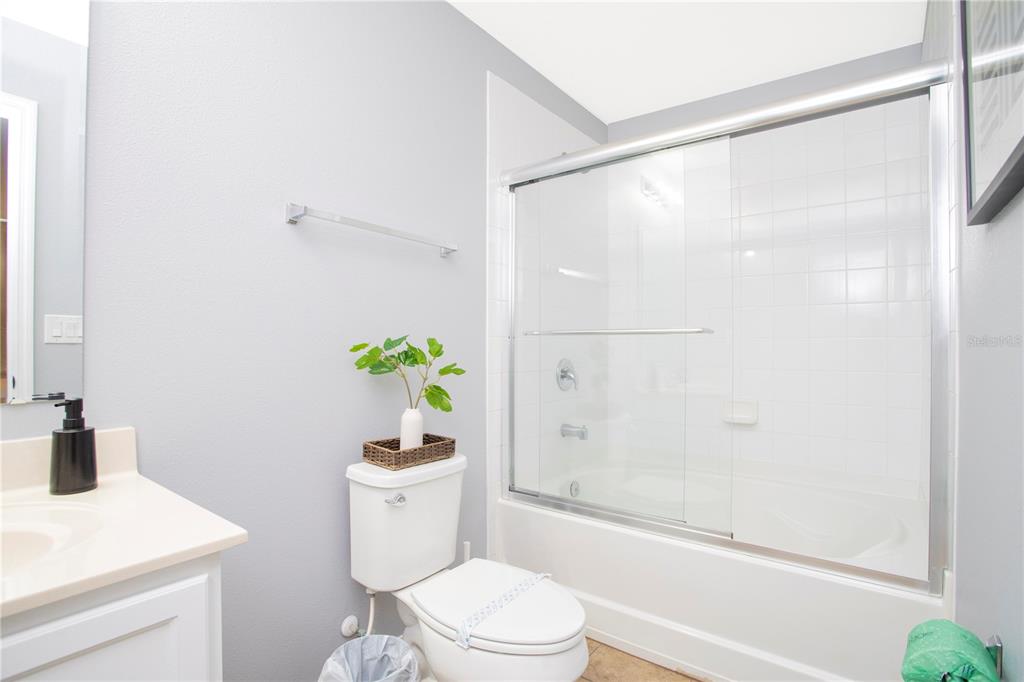 3181 Tocoa Circle Kissimmee, FL 34746 - Photo 86 of 87 a white toilet sitting next to a bathroom sink