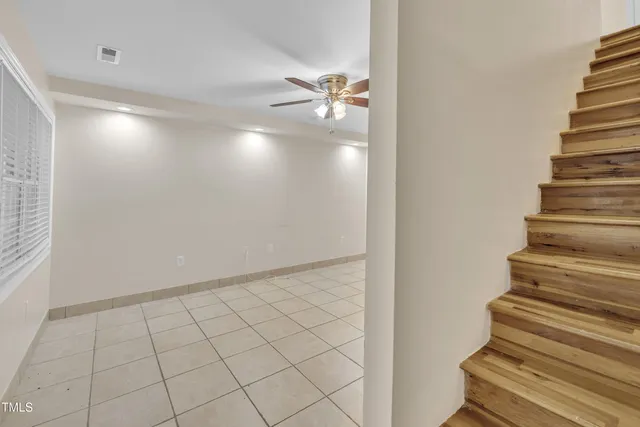 a kitchen with granite countertop white cabinets and a stainless steel appliances