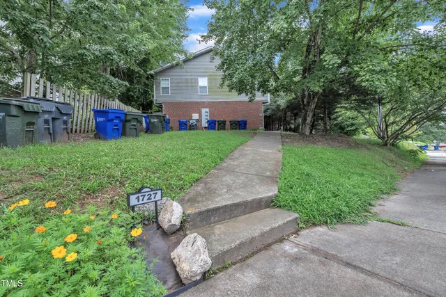 a picture of a bench in front of a building