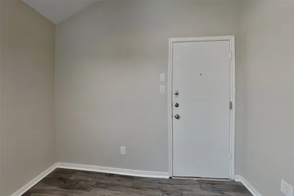 a view of small space with wooden floor