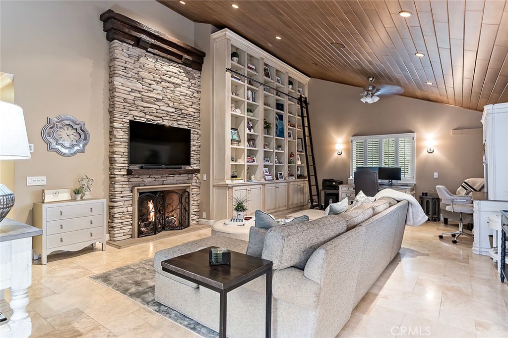 6250 Majorca Circle Long Beach, CA 90803 - Photo 16 of 35 a living room with furniture a fireplace and a flat screen tv