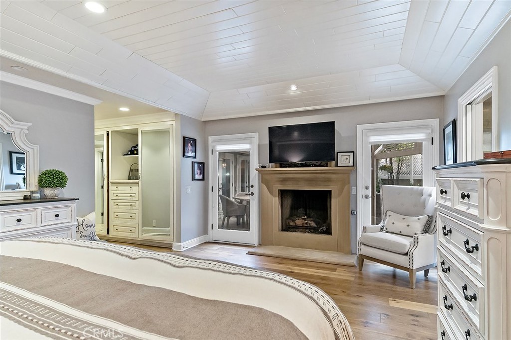 6250 Majorca Circle Long Beach, CA 90803 - Photo 25 of 35 a living room with furniture a fireplace and a flat screen tv