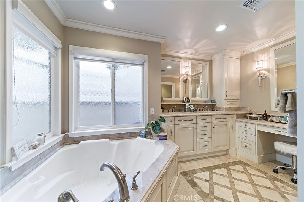 6250 Majorca Circle Long Beach, CA 90803 - Photo 26 of 35 a spacious bathroom with a granite countertop tub sink and mirror