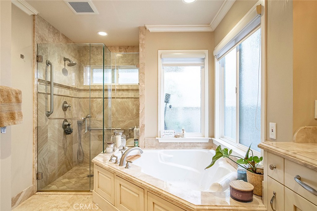 6250 Majorca Circle Long Beach, CA 90803 - Photo 27 of 35 a spacious bathroom with a granite countertop tub sink and large window