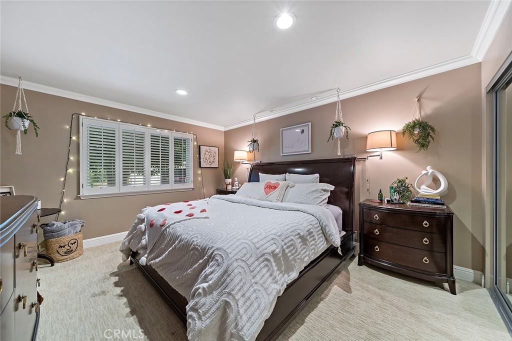 6250 Majorca Circle Long Beach, CA 90803 - Photo 29 of 35 a bedroom with a bed and wooden floor