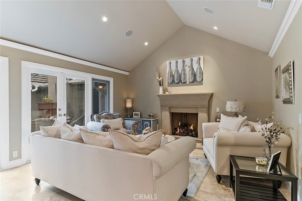 6250 Majorca Circle Long Beach, CA 90803 - Photo 9 of 35 a living room with furniture a fireplace and a large window