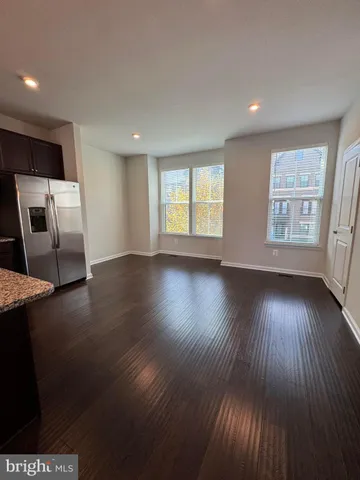 a bathroom with a glass door shower a toilet and a sink