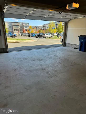 a view of an empty room with a fireplace