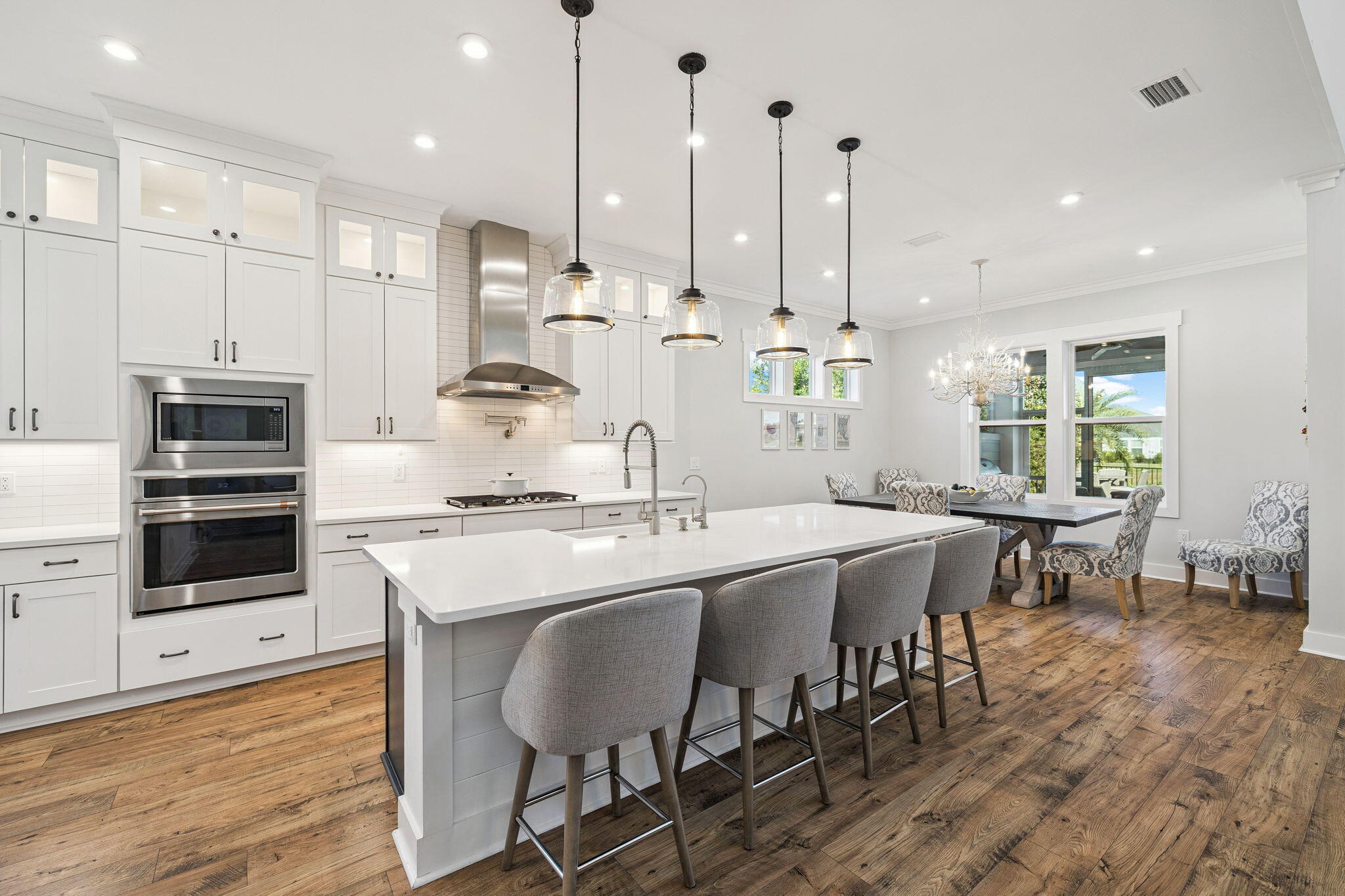 56 River Rise Way Inlet Beach Inlet Beach, FL 32461 - Photo 15 of 69 a kitchen with stainless steel appliances kitchen island a table chairs sink and cabinets