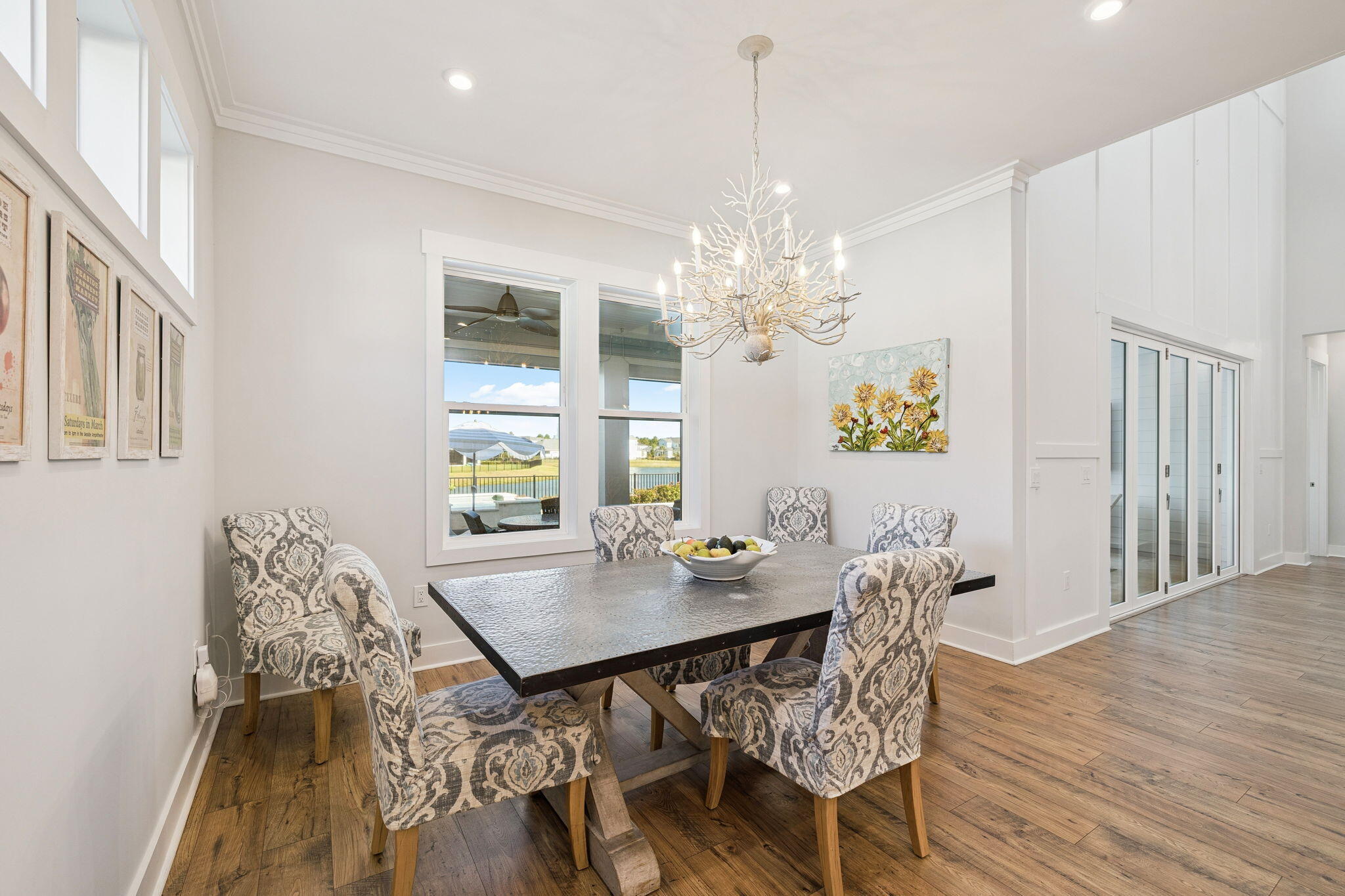 56 River Rise Way Inlet Beach Inlet Beach, FL 32461 - Photo 22 of 69 a view of a dining room with furniture wooden floor and chandelier