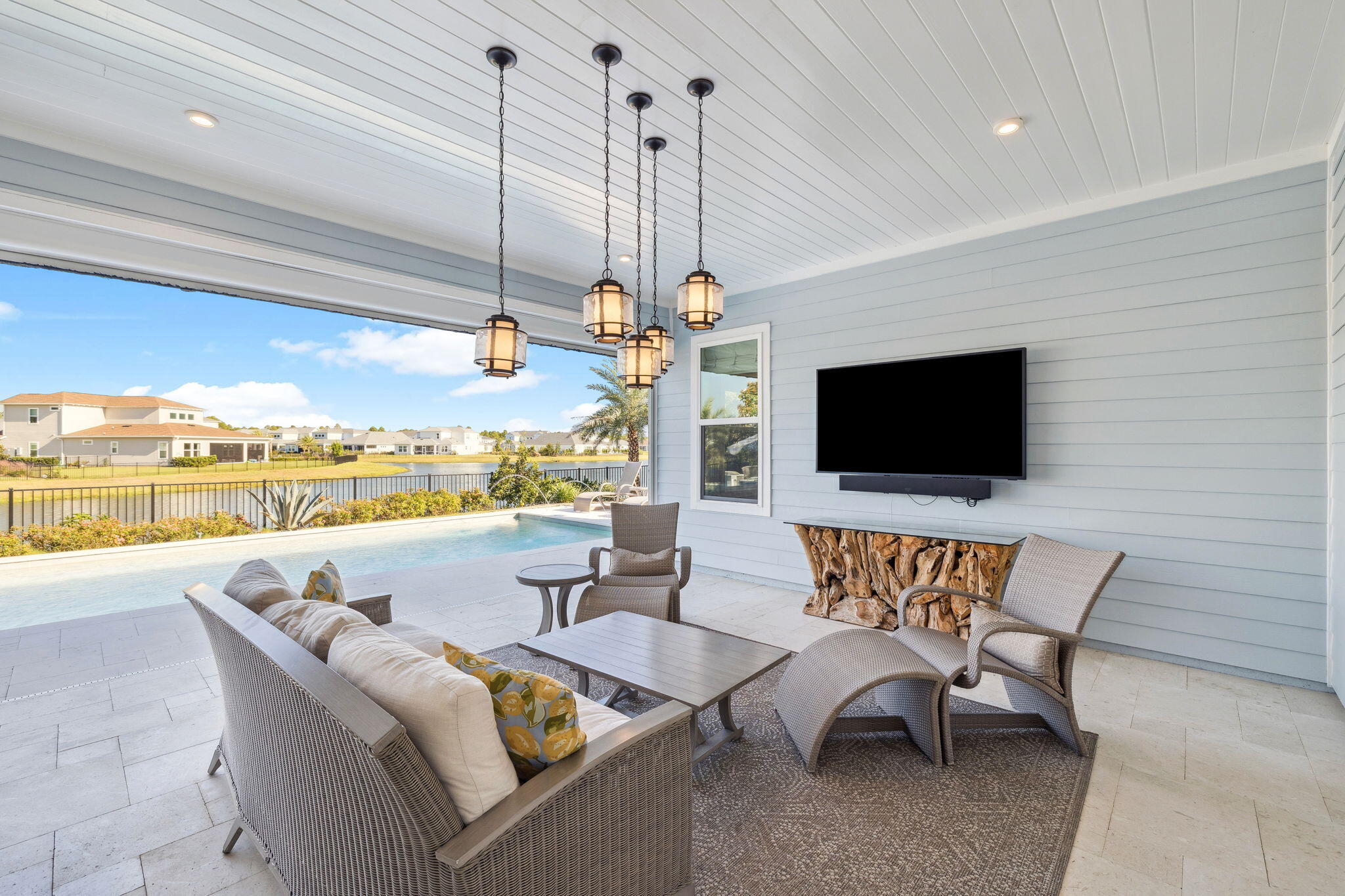 56 River Rise Way Inlet Beach Inlet Beach, FL 32461 - Photo 62 of 69 a living room with patio furniture and a flat screen tv