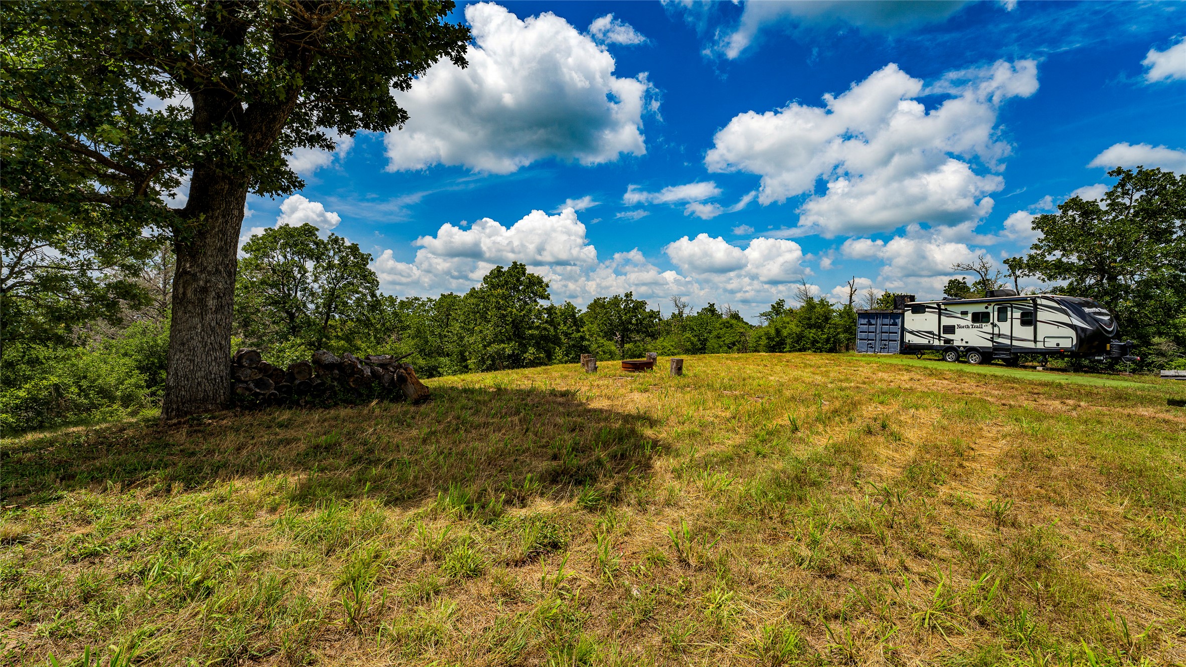 1470 22 Hills Road Gause, TX 77857 - Photo 2 of 35 A spacious, naturally illuminated lot offers verdant surroundings, ideal for building a dream home.