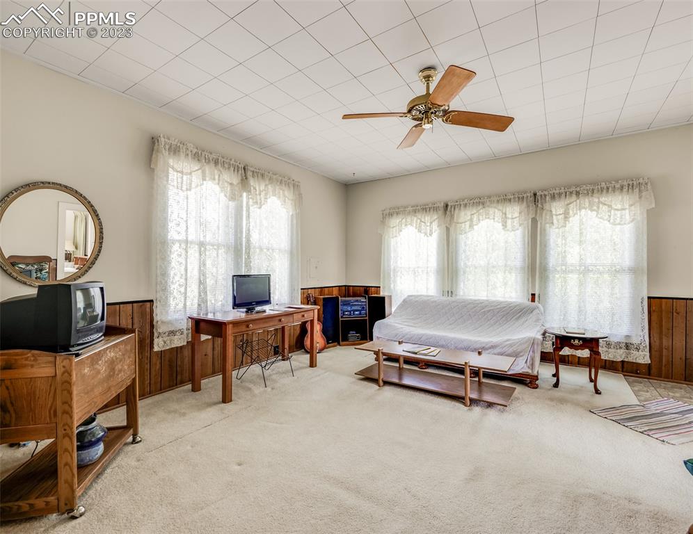 2 County Road 81 Victor, CO 80860 - Photo 13 of 28 a living room with furniture gym equipment and a large window