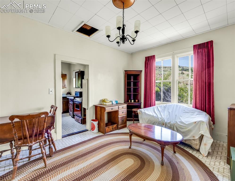2 County Road 81 Victor, CO 80860 - Photo 14 of 28 a living room with furniture a chandelier and a rug