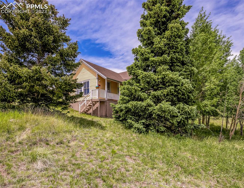 2 County Road 81 Victor, CO 80860 - Photo 2 of 28 a view of a house with a yard