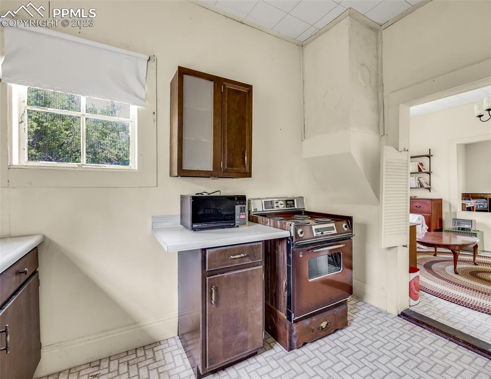 2 County Road 81 Victor, CO 80860 - Photo 24 of 28 a kitchen with a stove and a sink