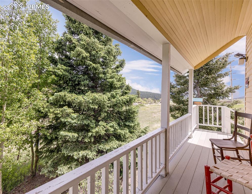 2 County Road 81 Victor, CO 80860 - Photo 7 of 28 a view of a balcony with wooden floor
