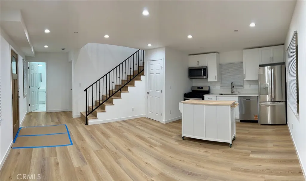 18654 Runnymede Street Reseda, CA 91335 - Photo 2 of 12 a view of kitchen with cabinets stainless steel appliances a sink and a stove