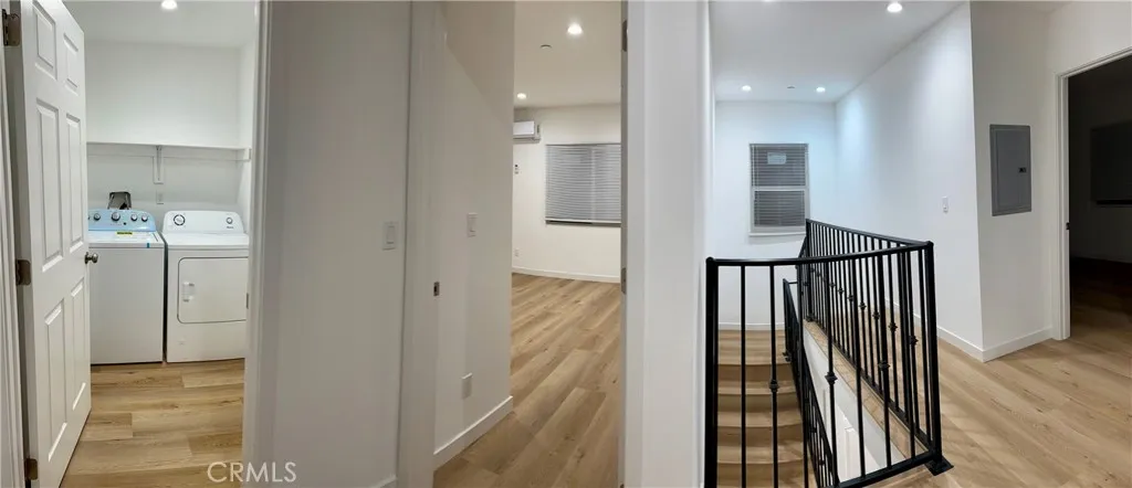 18654 Runnymede Street Reseda, CA 91335 - Photo 7 of 12 a view of a hallway with wooden floor and staircase