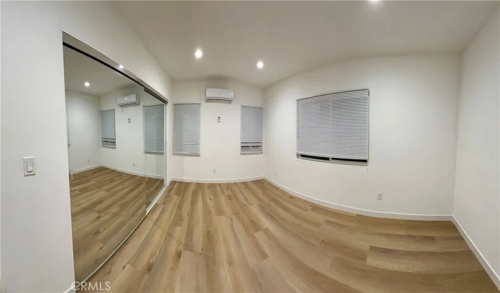18654 Runnymede Street Reseda, CA 91335 - Photo 9 of 12 a view of empty room with wooden floor and fan