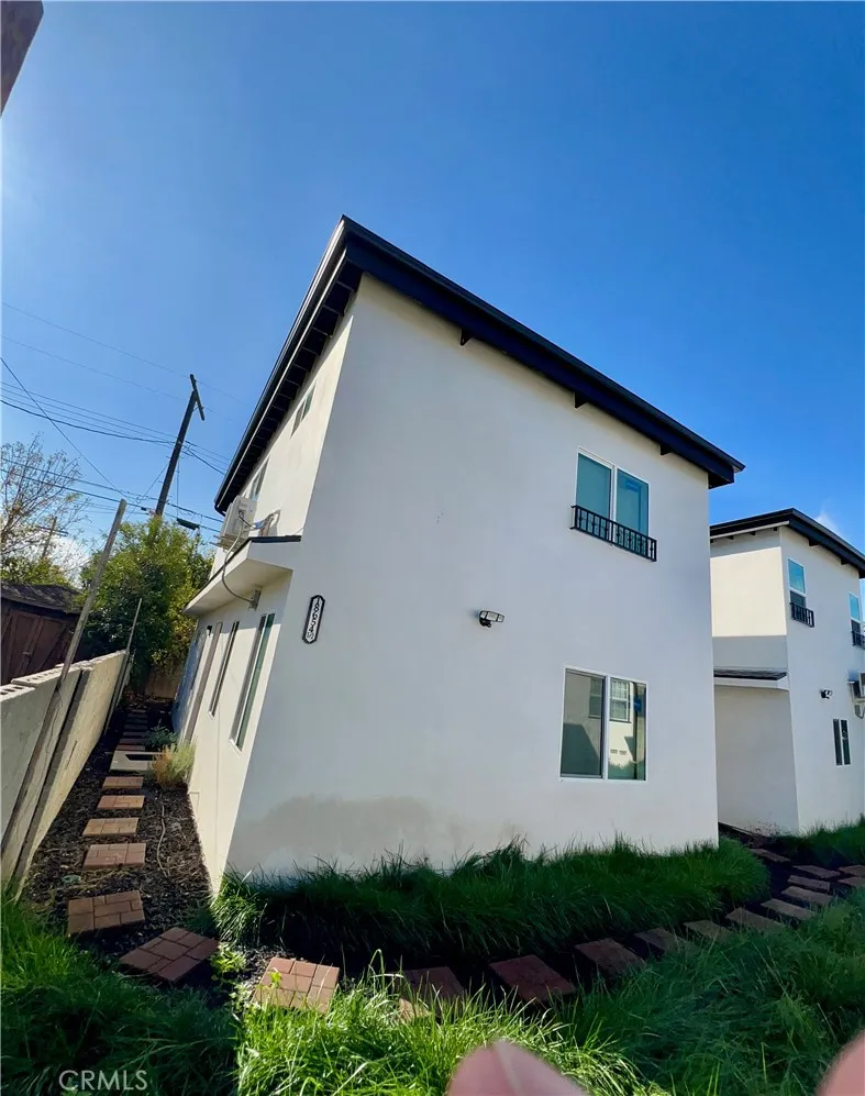 18654 Runnymede Street Reseda, CA 91335 - Photo 10 of 12 a front view of a house with garden