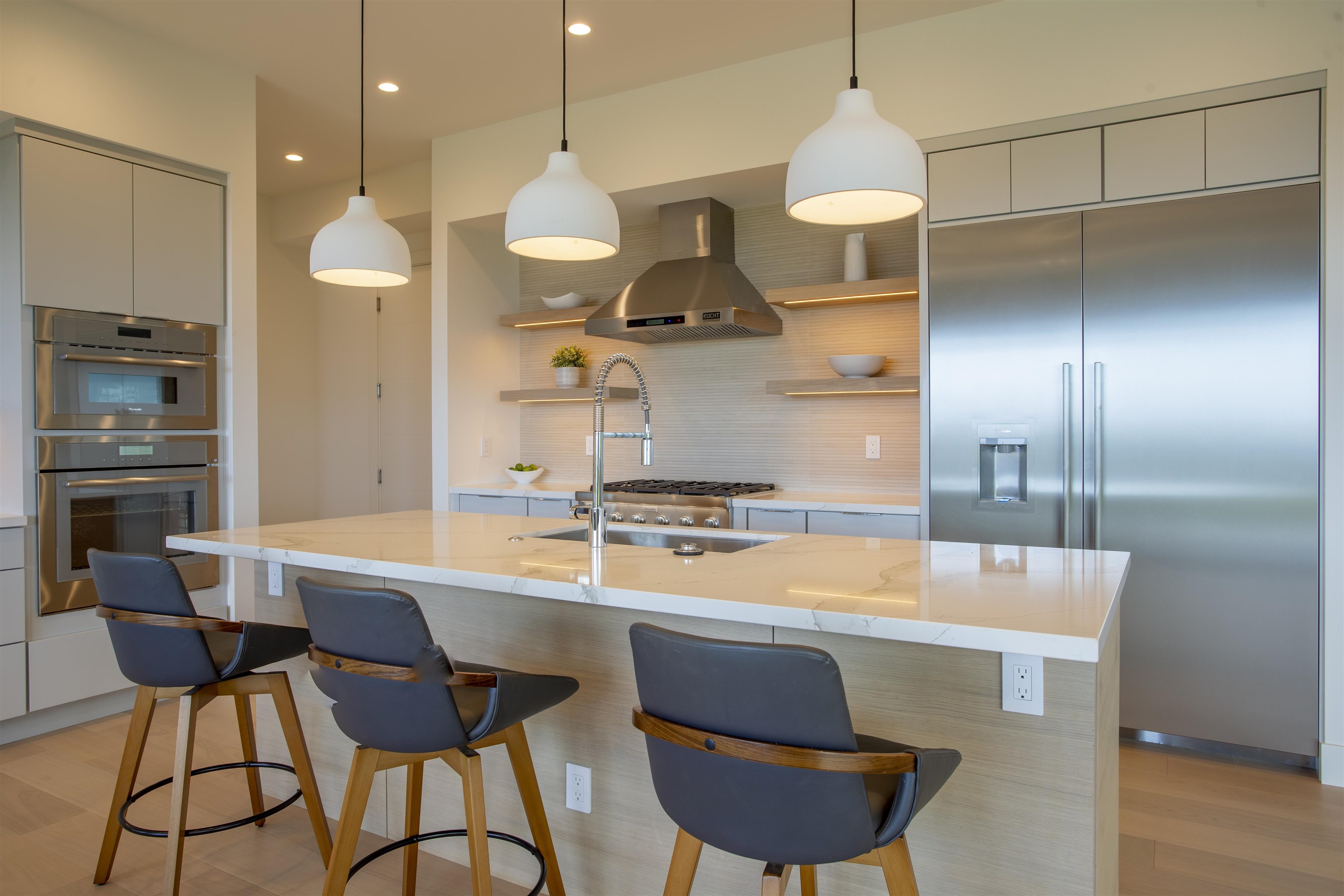 111 Mehana Road, Unit A Haiku, HI 96708 - Photo 11 of 41 a large kitchen with a table and chairs