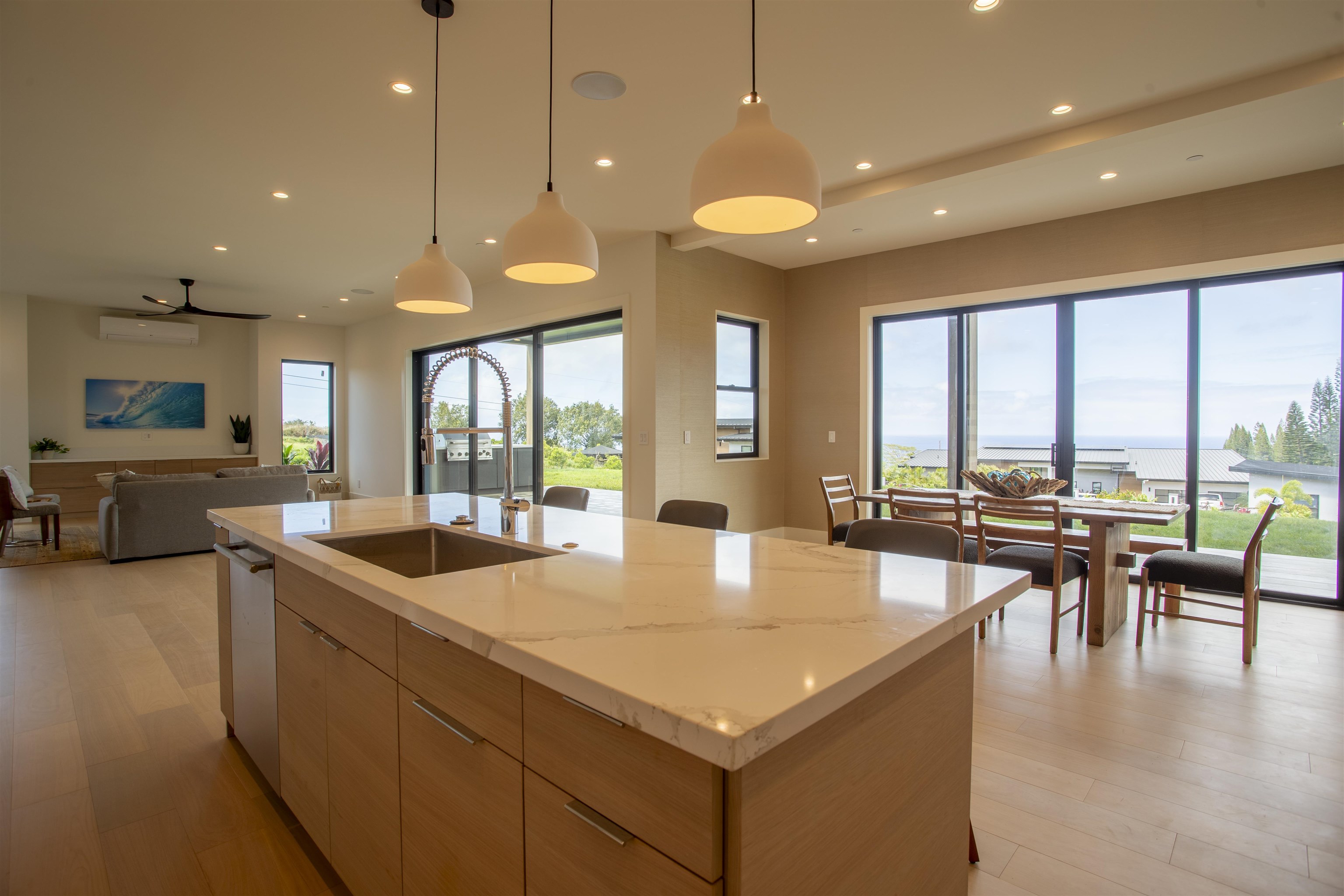 111 Mehana Road, Unit A Haiku, HI 96708 - Photo 12 of 41 a large kitchen with a large window and furniture