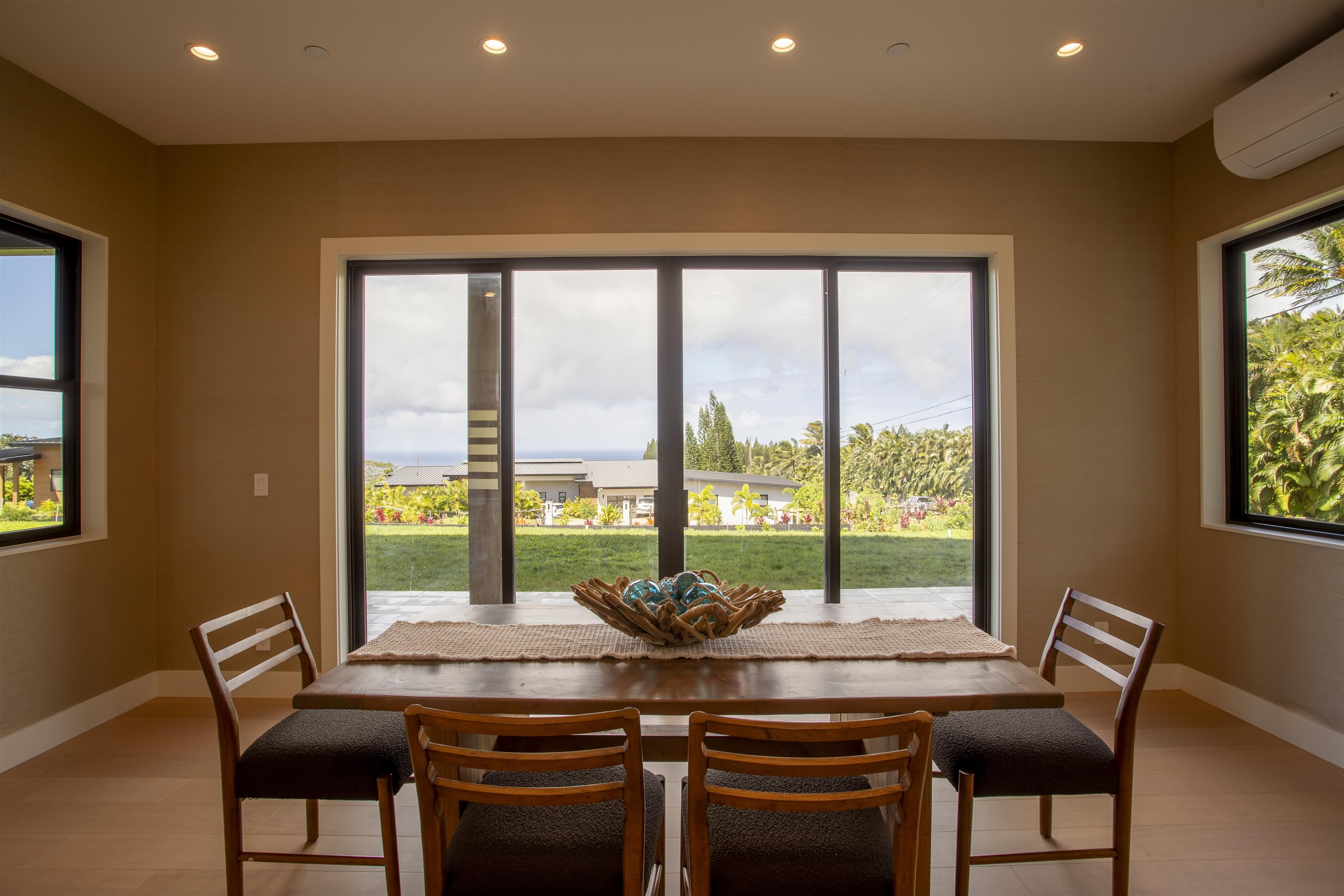 111 Mehana Road, Unit A Haiku, HI 96708 - Photo 13 of 41 a view of a dining room with furniture window and outside view