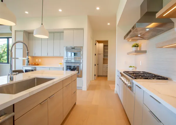 a kitchen with a stove and cabinets