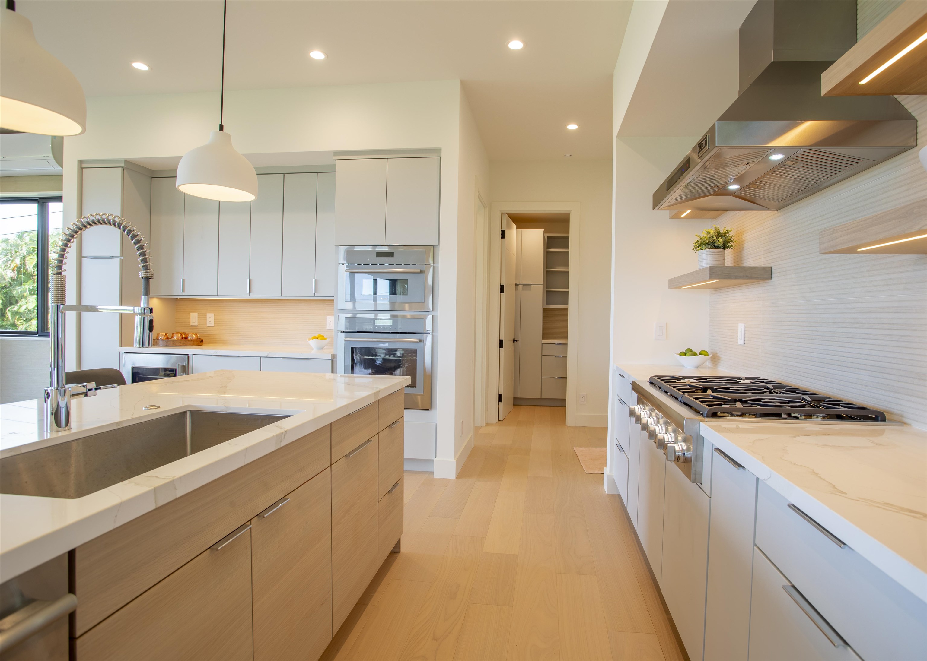 111 Mehana Road, Unit A Haiku, HI 96708 - Photo 14 of 41 a kitchen with a sink a stove and refrigerator