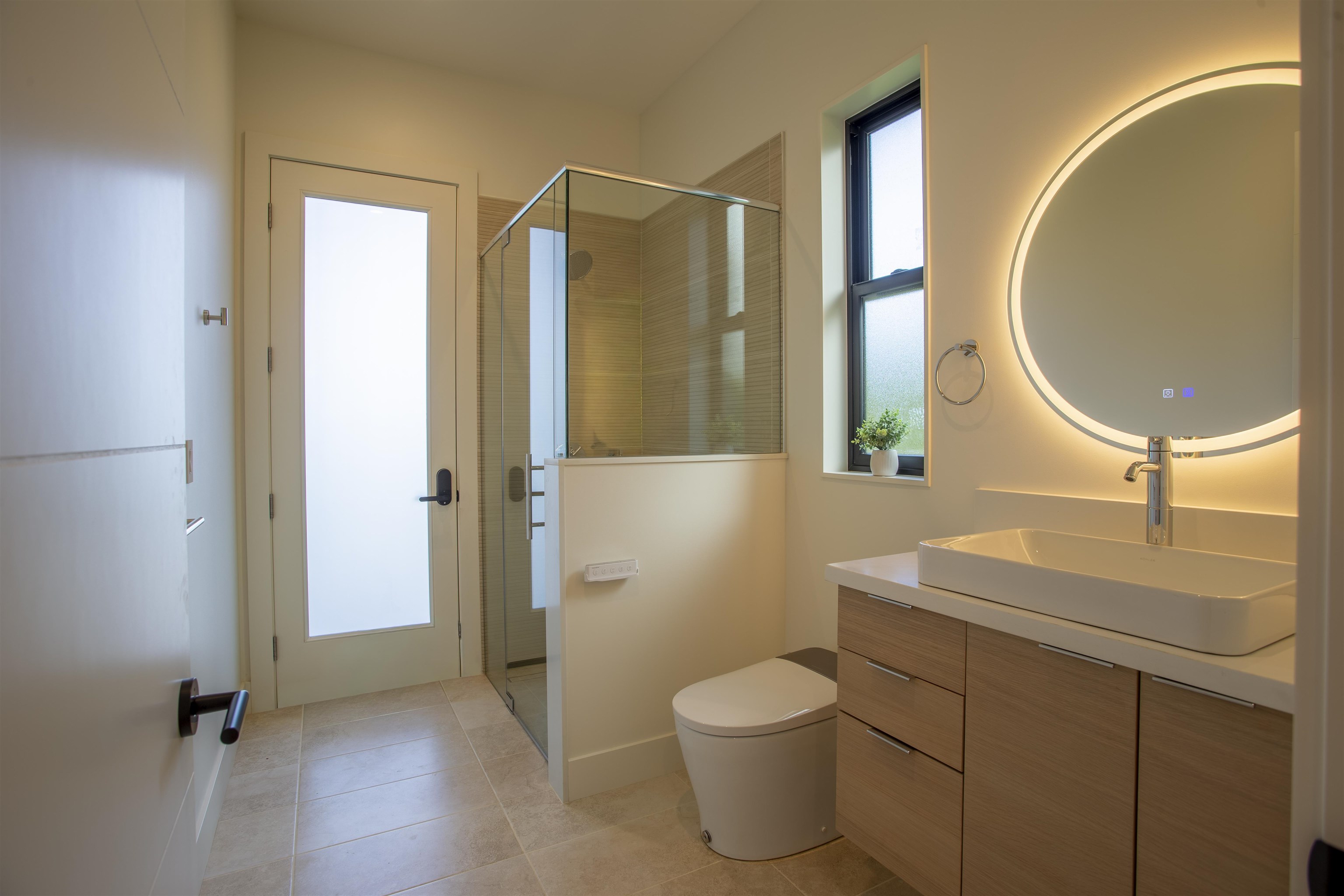111 Mehana Road, Unit A Haiku, HI 96708 - Photo 16 of 41 a bathroom with a toilet sink and mirror