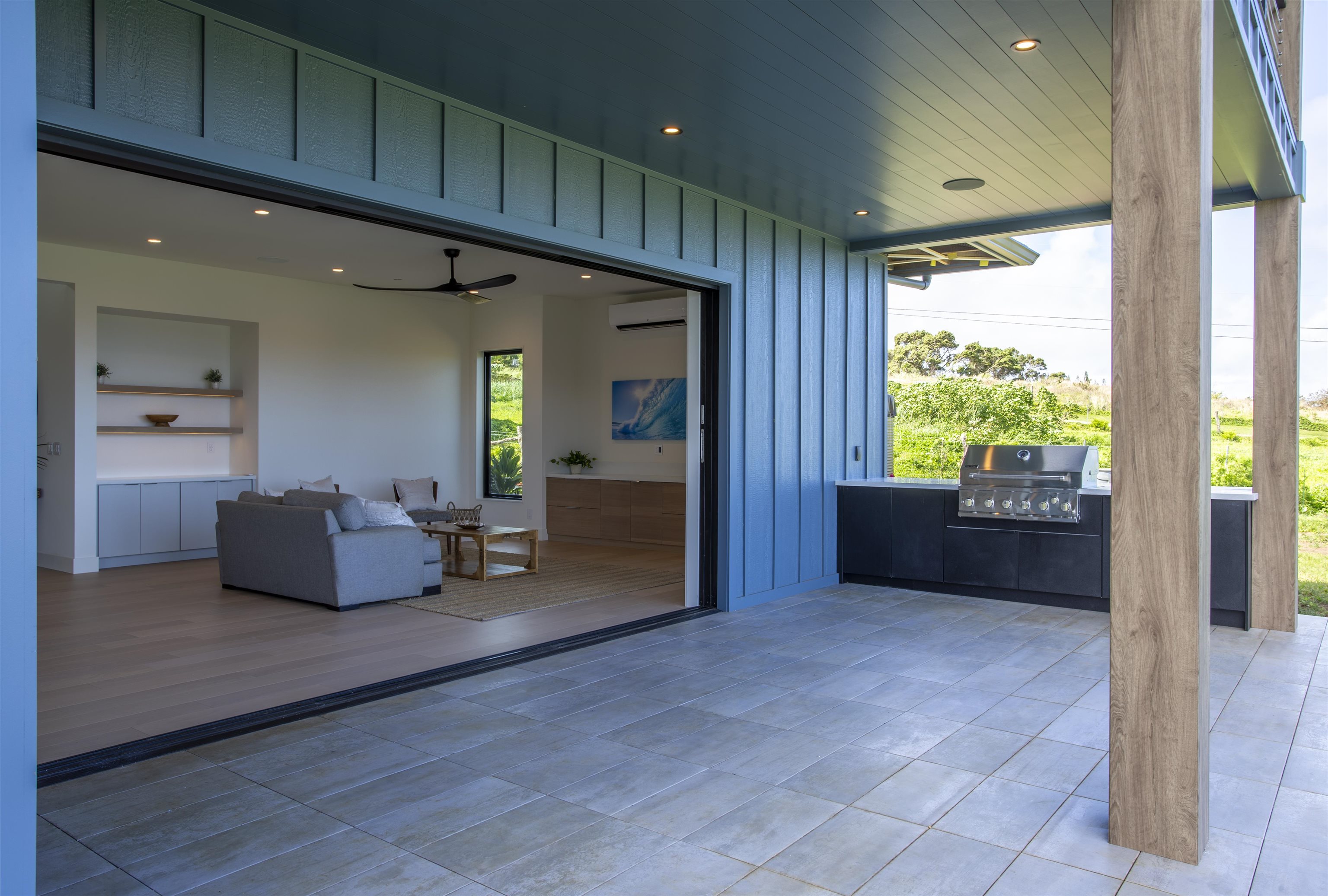 111 Mehana Road, Unit A Haiku, HI 96708 - Photo 20 of 41 a living room with furniture and a large window
