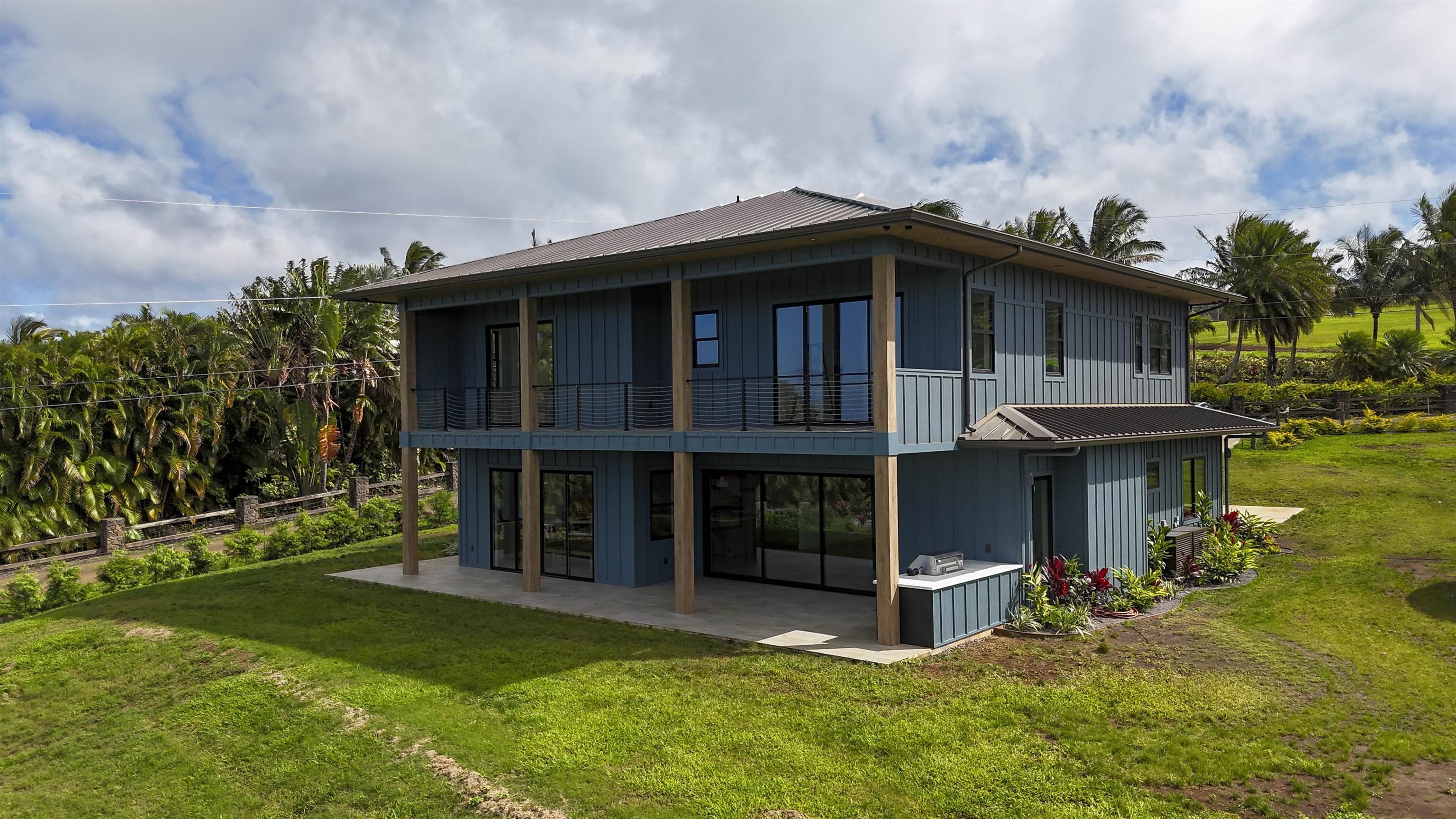 111 Mehana Road, Unit A Haiku, HI 96708 - Photo 2 of 41 a view of a house with a yard plants and large tree