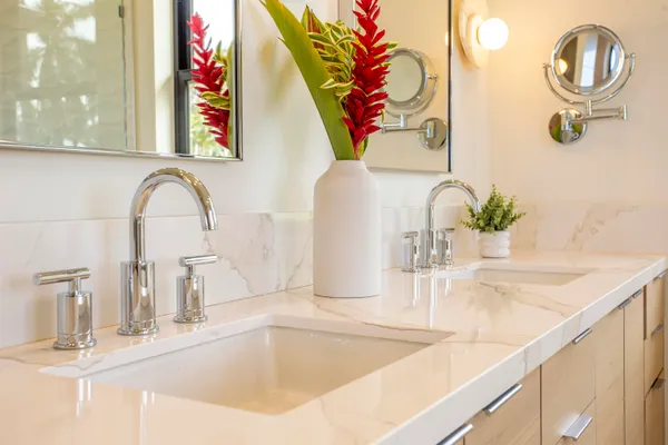 a white bath tub sitting next to a window