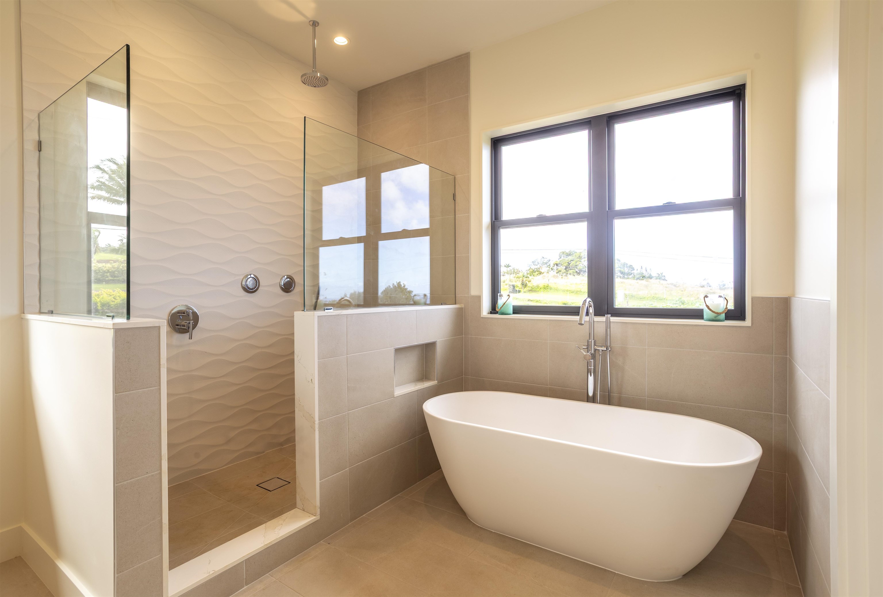 111 Mehana Road, Unit A Haiku, HI 96708 - Photo 26 of 41 a white bath tub sitting next to a window