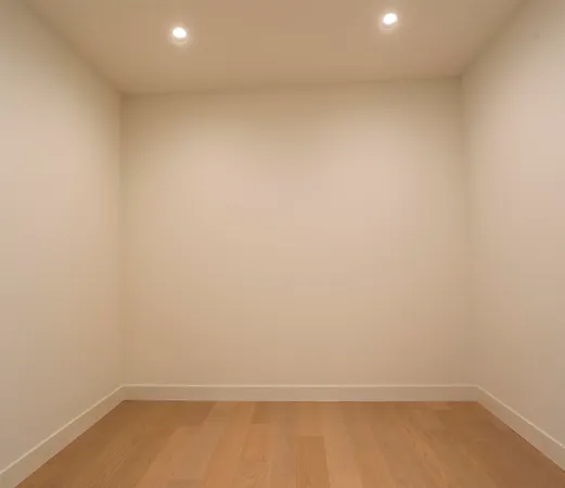 a bedroom with a large bed and a tv