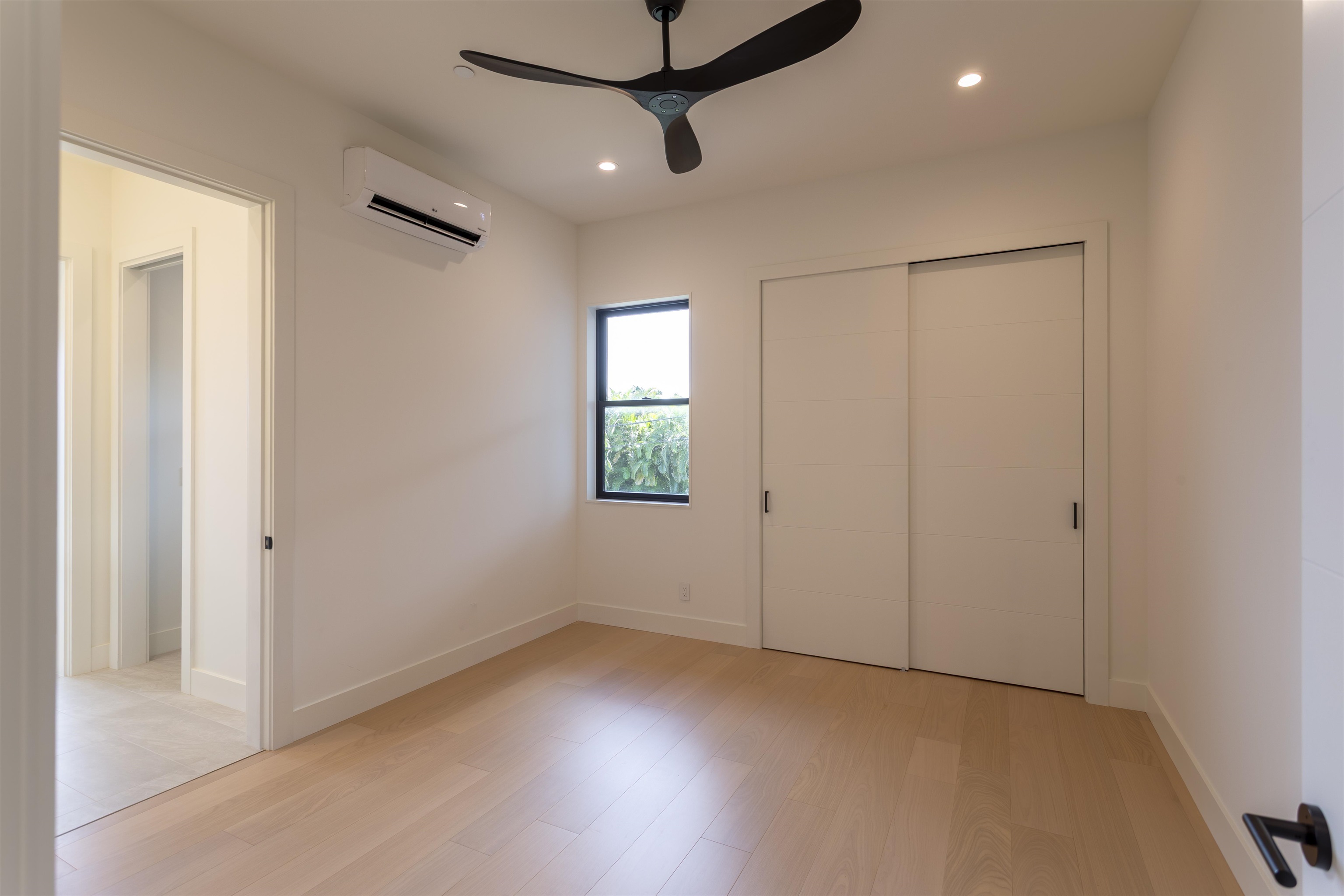 111 Mehana Road, Unit A Haiku, HI 96708 - Photo 35 of 41 an empty room with windows and fan