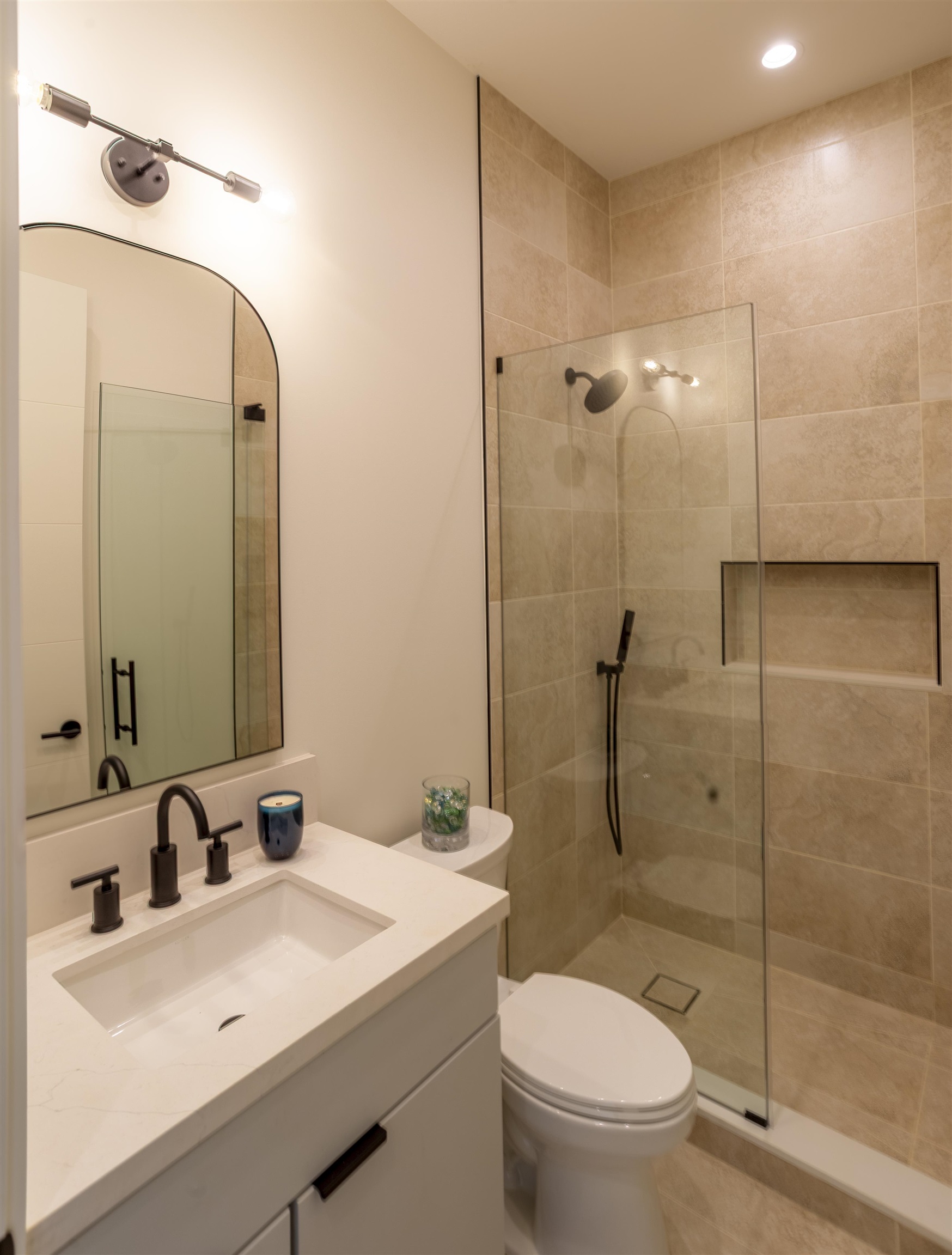 111 Mehana Road, Unit A Haiku, HI 96708 - Photo 38 of 41 a bathroom with a sink toilet and shower