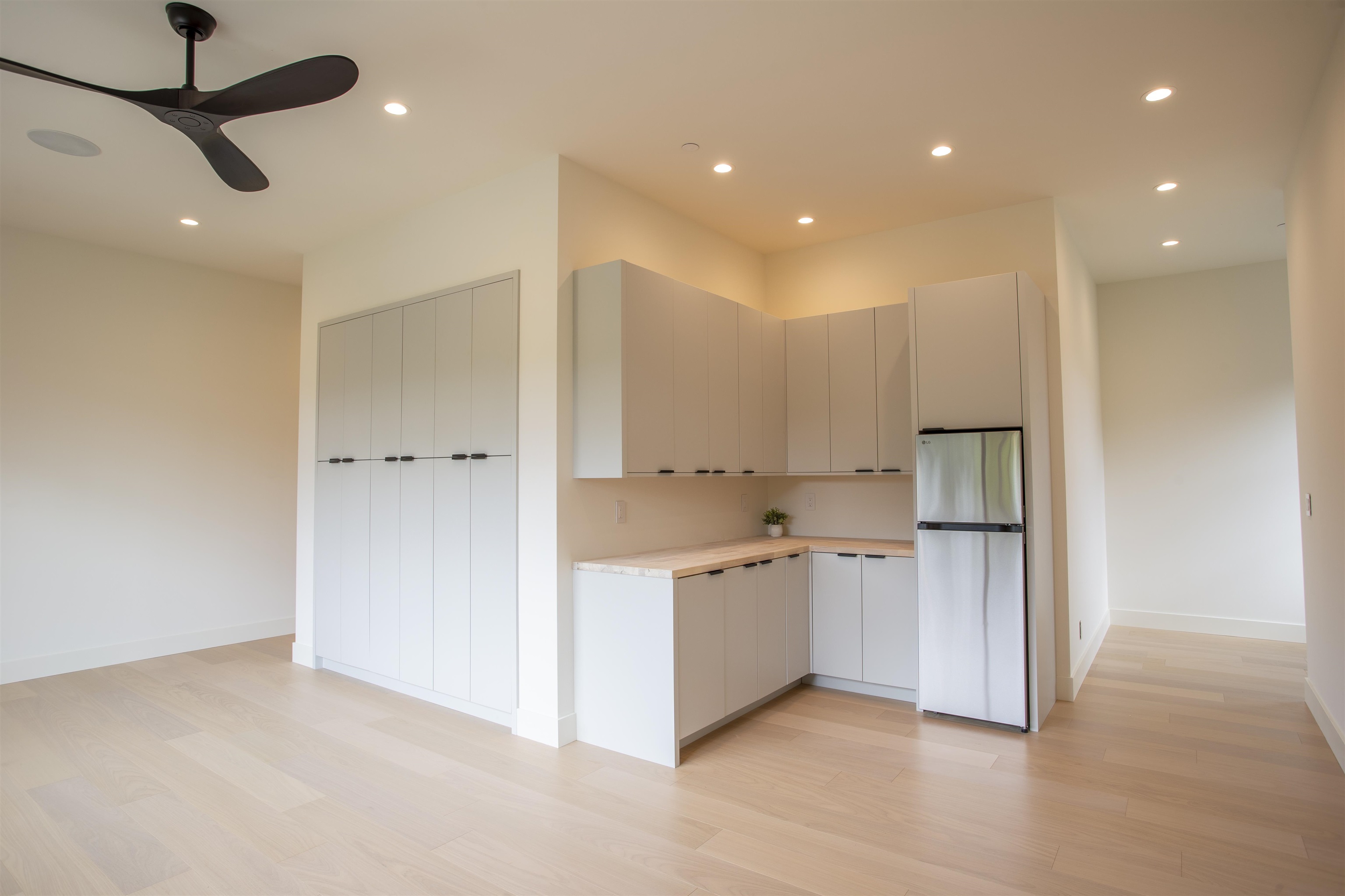 111 Mehana Road, Unit A Haiku, HI 96708 - Photo 39 of 41 a kitchen with stainless steel appliances a refrigerator and a sink