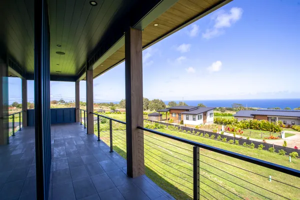 a view of a balcony with wooden floor