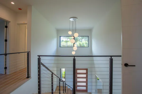 a kitchen with a dining table chairs and view of kitchen