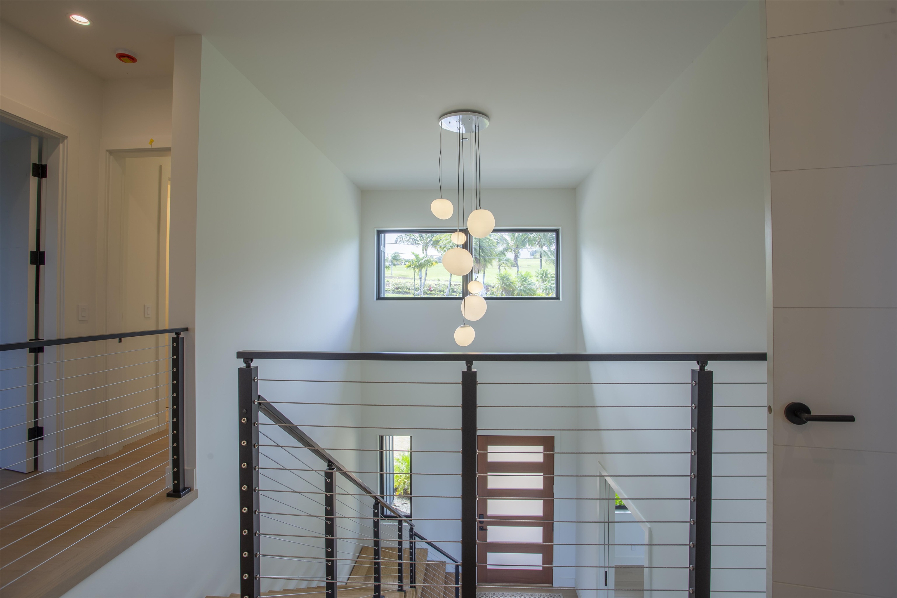 111 Mehana Road, Unit A Haiku, HI 96708 - Photo 8 of 41 a view of entryway and hall with wooden floor