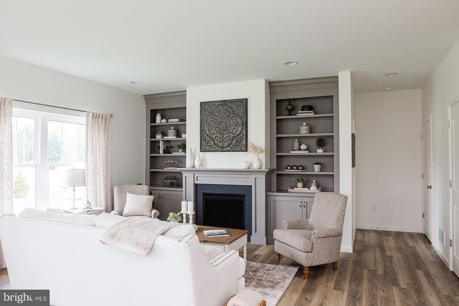 Wickmere Street, Unit F Oxford, PA 19363 - Photo 13 of 43 a living room with furniture a fireplace and a table