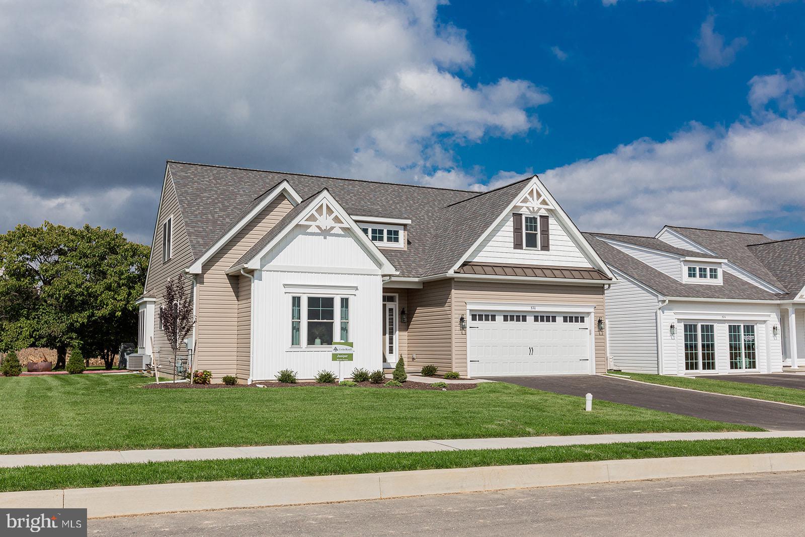 Wickmere Street, Unit F Oxford, PA 19363 - Photo 3 of 43 a view of house with a big yard and large trees