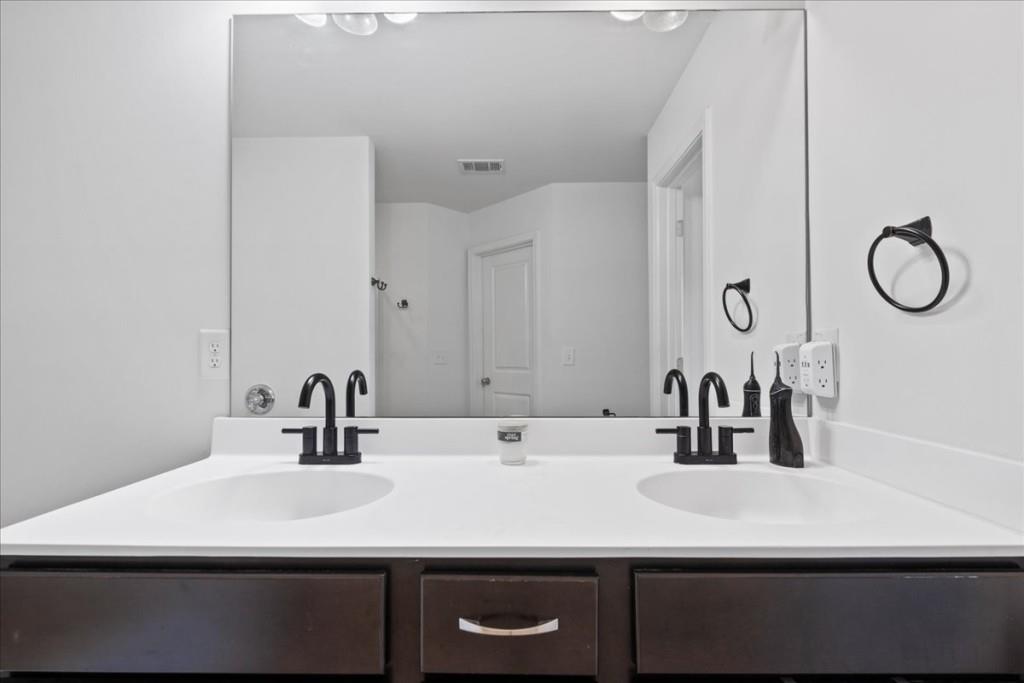 4998 Longview Walk Decatur, GA 30035 - Photo 20 of 29 a bathroom with a sink and a mirror